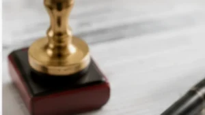 Notary stamp and pen beside official paperwork representing apostille and notarization requirements